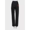 Black button-down jeans with embroidery
