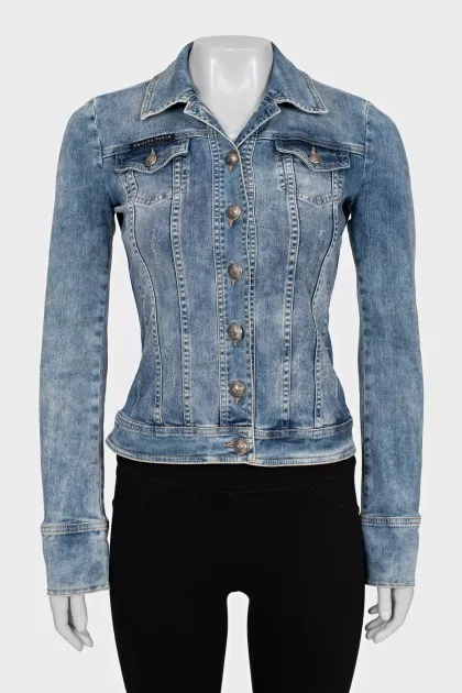 The denim jacket is decorated with rhinestones.