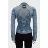 The denim jacket is decorated with rhinestones.