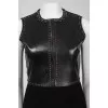 Dress with leather insert and metal appliqué