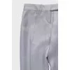 Silver trousers with creases