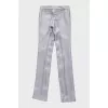 Silver trousers with creases