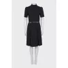 Black dress with gold trim on the belt