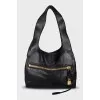 Leather bag with a gold lock