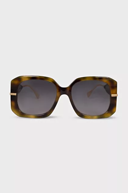 Sunglasses with a gold logo