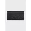 Black leather wallet with branded embossing
