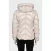 White fitted down jacket with a zipper