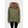 Parka with pockets decorated with fur