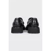 Black leather loafers