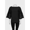 Black blouse with perforated sleeves