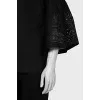 Black blouse with perforated sleeves