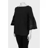 Black blouse with perforated sleeves