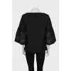 Black blouse with perforated sleeves