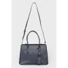 Blue bag with interior decoration of red leather