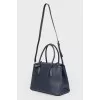 Blue bag with interior decoration of red leather