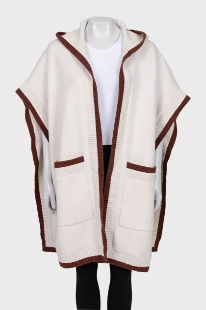 White cape with brand logo