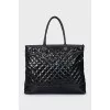 Quilted leather bag with brand logo