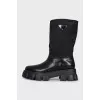 Black boots with silver logo