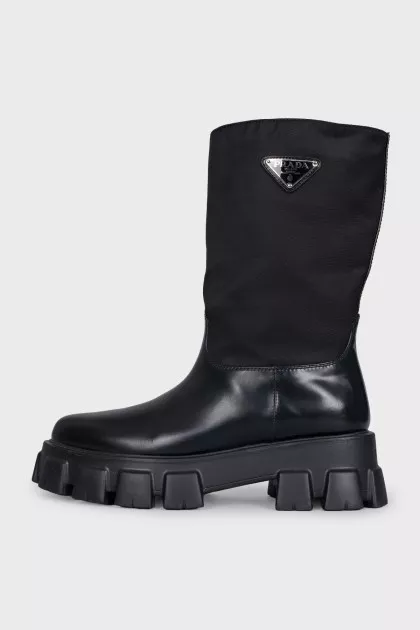 Black boots with silver logo
