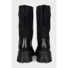 Black boots with silver logo
