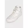 White leather high-top sneakers