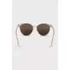 Gold sunglasses with white temples