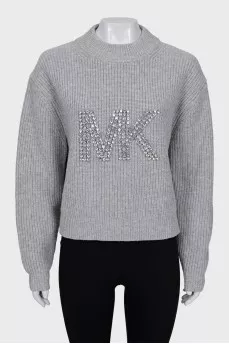 Knitted sweater with decorated logo