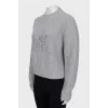 Knitted sweater with decorated logo