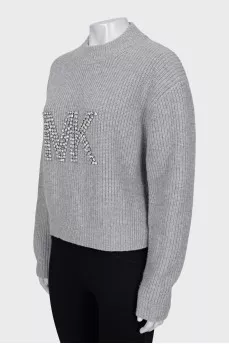 Knitted sweater with decorated logo