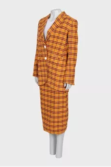 Suit consisting of a jacket and skirt with a slit