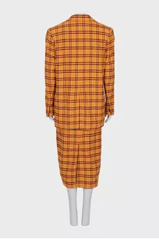 Suit consisting of a jacket and skirt with a slit