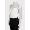Cropped top decorated with perforations