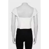 Cropped top decorated with perforations