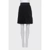 Black pleated mini skirt