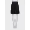 Black pleated mini skirt