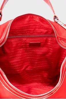 Textile bag with leather logo