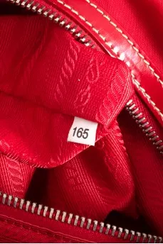 Textile bag with leather logo