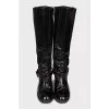 Boots decorated with a leather strap