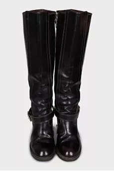 Boots decorated with a leather strap