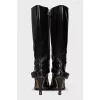 Boots decorated with a leather strap