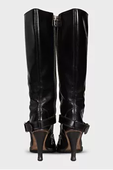 Boots decorated with a leather strap