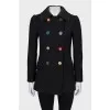 Fitted coat with an accent fastening