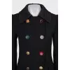 Fitted coat with an accent fastening