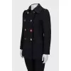 Fitted coat with an accent fastening