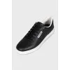 Black leather lace-up sneakers