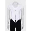 White top with ties and silver logo
