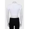 White top with ties and silver logo