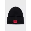 Men's black hat with a red logo