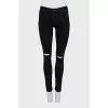 Skinny jeans with rips