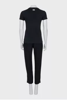A suit consisting of a T-shirt, jacket, and trousers with trim